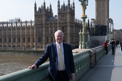 Clive standing on Westminister Bridge with Parliament behind him