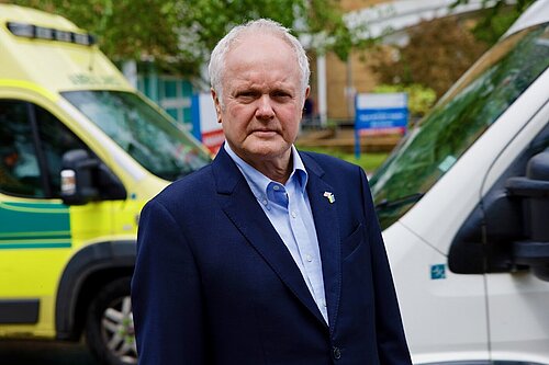Clive with ambulance in background
