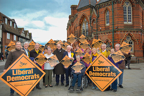 Ed Davey, Clive Jones and other Lib Dems outside Wokingham town hall holding Lib dem diamonds
