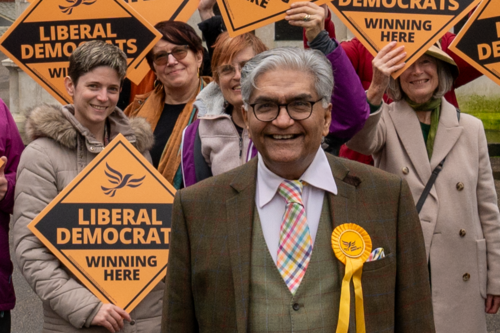 Tahir with Lib Dems holding "winning here" signs