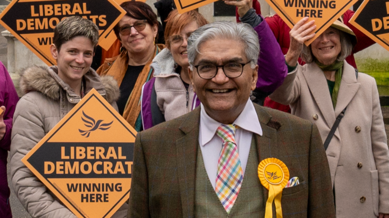 Tahir with Lib Dems holding "winning here" signs