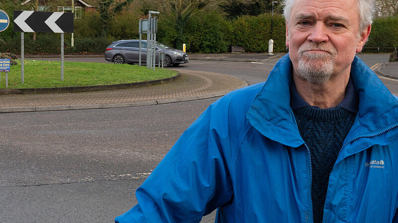 Rob Comber with a bike by the roundabout on Finchampstead Road