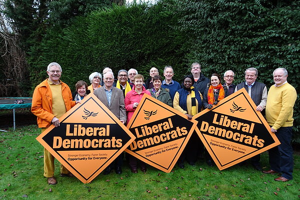 Lib Dems with "Winning here" diamonds in a playing field in Earley