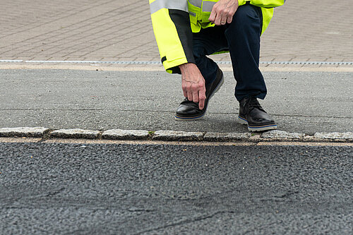 Paul examining the newly resurfaced road