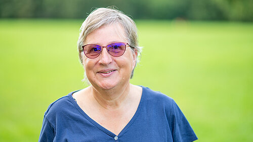 Prue Bray standing in a field