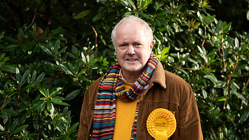 Clive Jones outside wearing a scarf