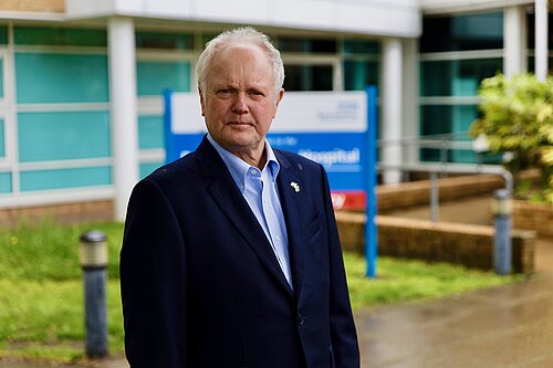 Clive outside the Royal Berkshire Hospital looking serious